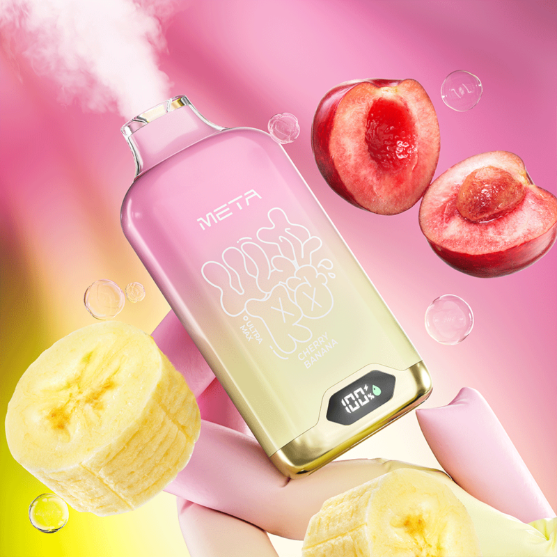 Un dispositivo de vapeo rosa y amarillo etiquetado "META Cherry Banana" que emite vapor, rodeado de rodajas de plátano fresco y cerezas sobre un fondo degradado vibrante.