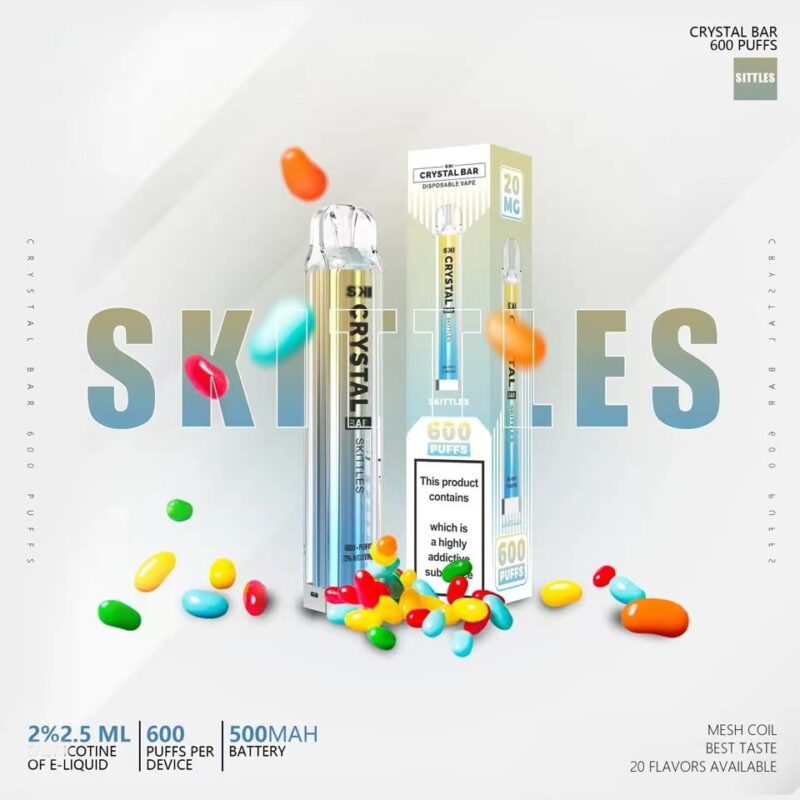 Promotional image for Crystal Bar Skittles flavor disposable vape highlighting 600 puffs, with colorful candy pieces scattered around, and product details like 2% nicotine and 500mAh battery.